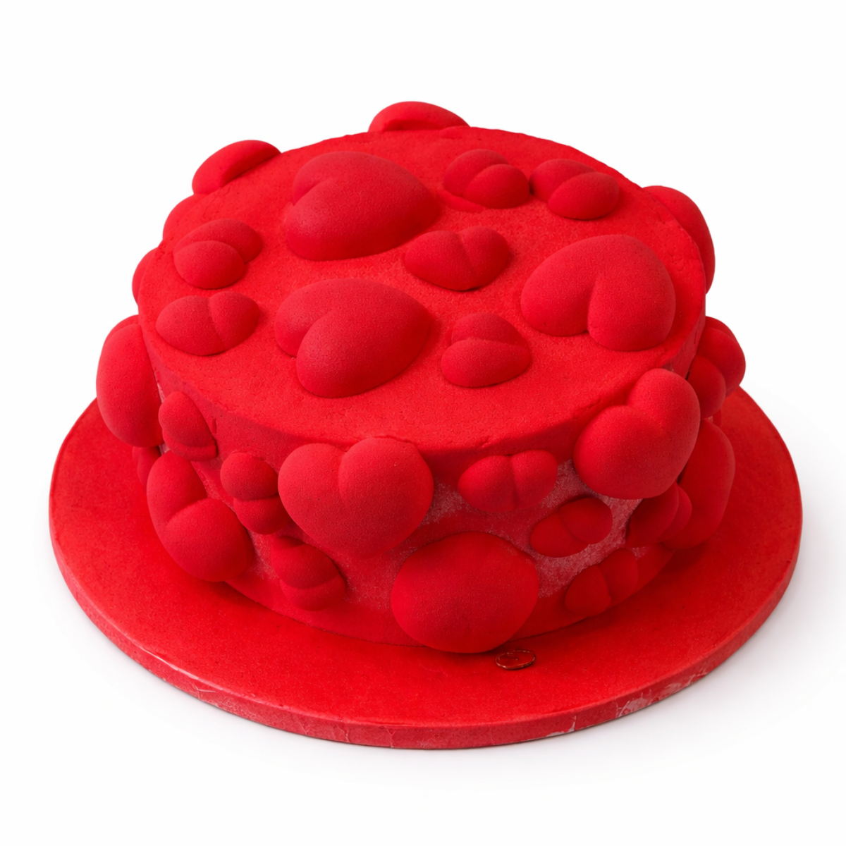 Red heart mousse cake decorated with heart shapes on white background for romantic celebration